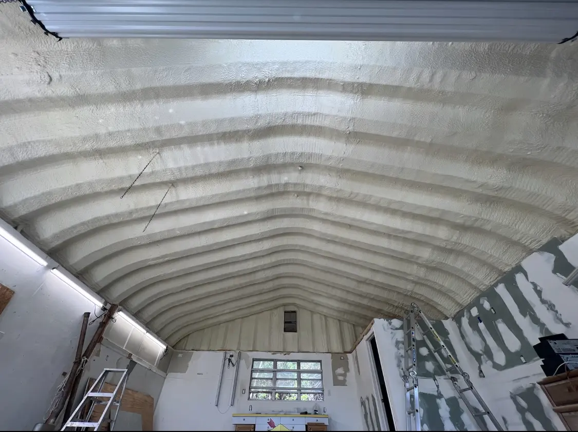 Spray polyurethane foam applied to the underside of a metal roof deck in Burton