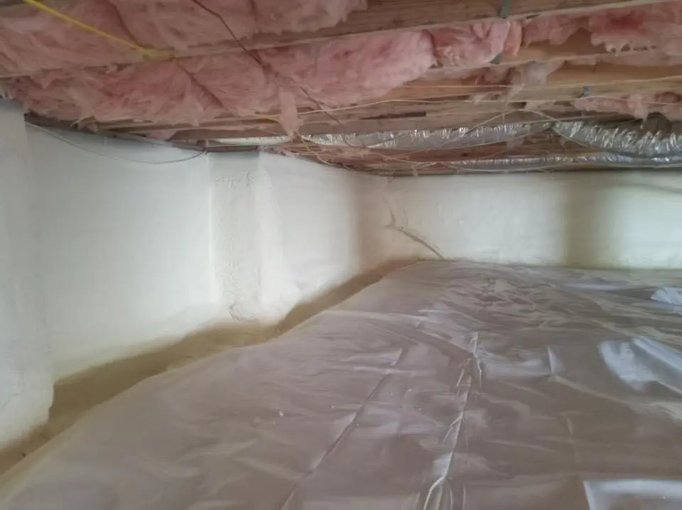Crawl space encapsulation with closed-cell spray foam for Storm Damage Roof Repair in Burton